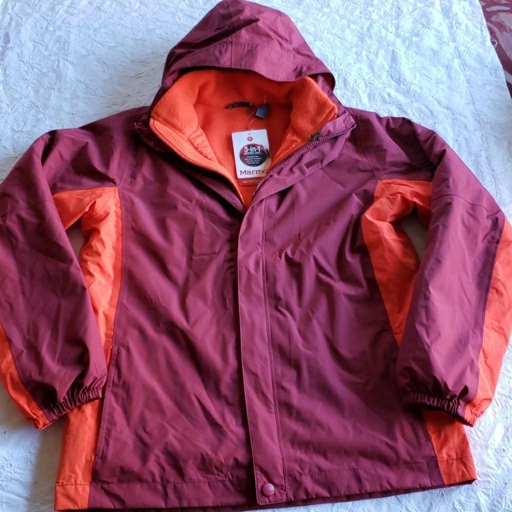 Marmot waterproof breathable orange and purple kids jacket nee size XL